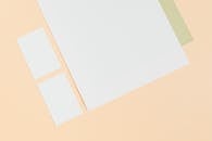 Blank Paper Sheets on Yellow Background