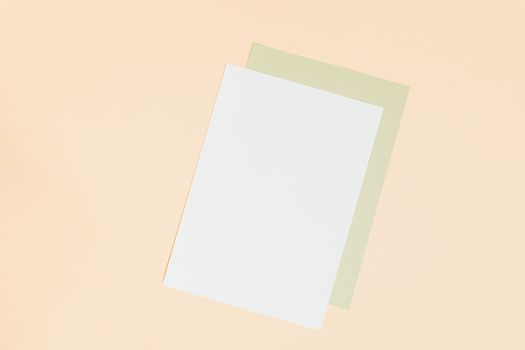 Simple minimalist design with blank paper on pastel background.
