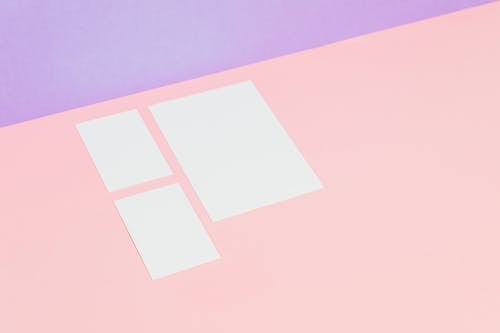 Photo of Blank Cards on a Pink Surface