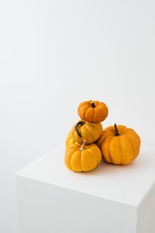 Orange Pumpkins on White Table