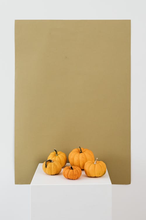 Fresh Pumpkins on White Table