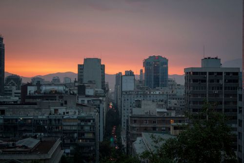 Free A vibrant city skyline at twilight, showcasing towering skyscrapers against a colorful sunset sky. Stock Photo