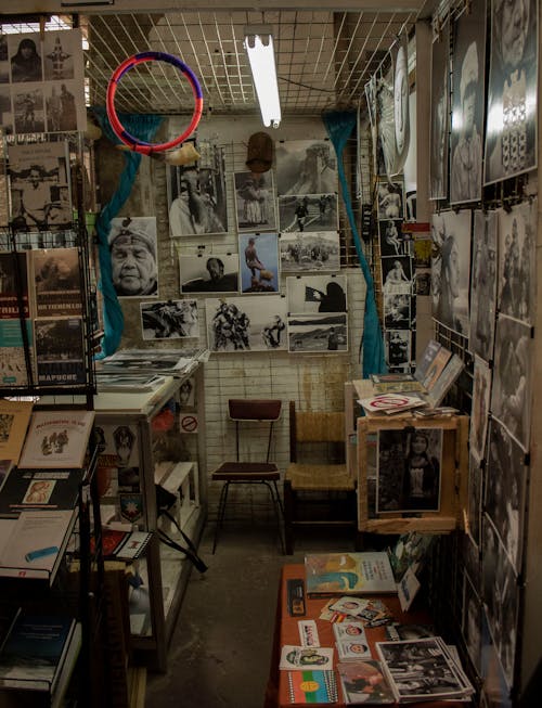 A Shop With Posters and Pictures Hanging on Wall