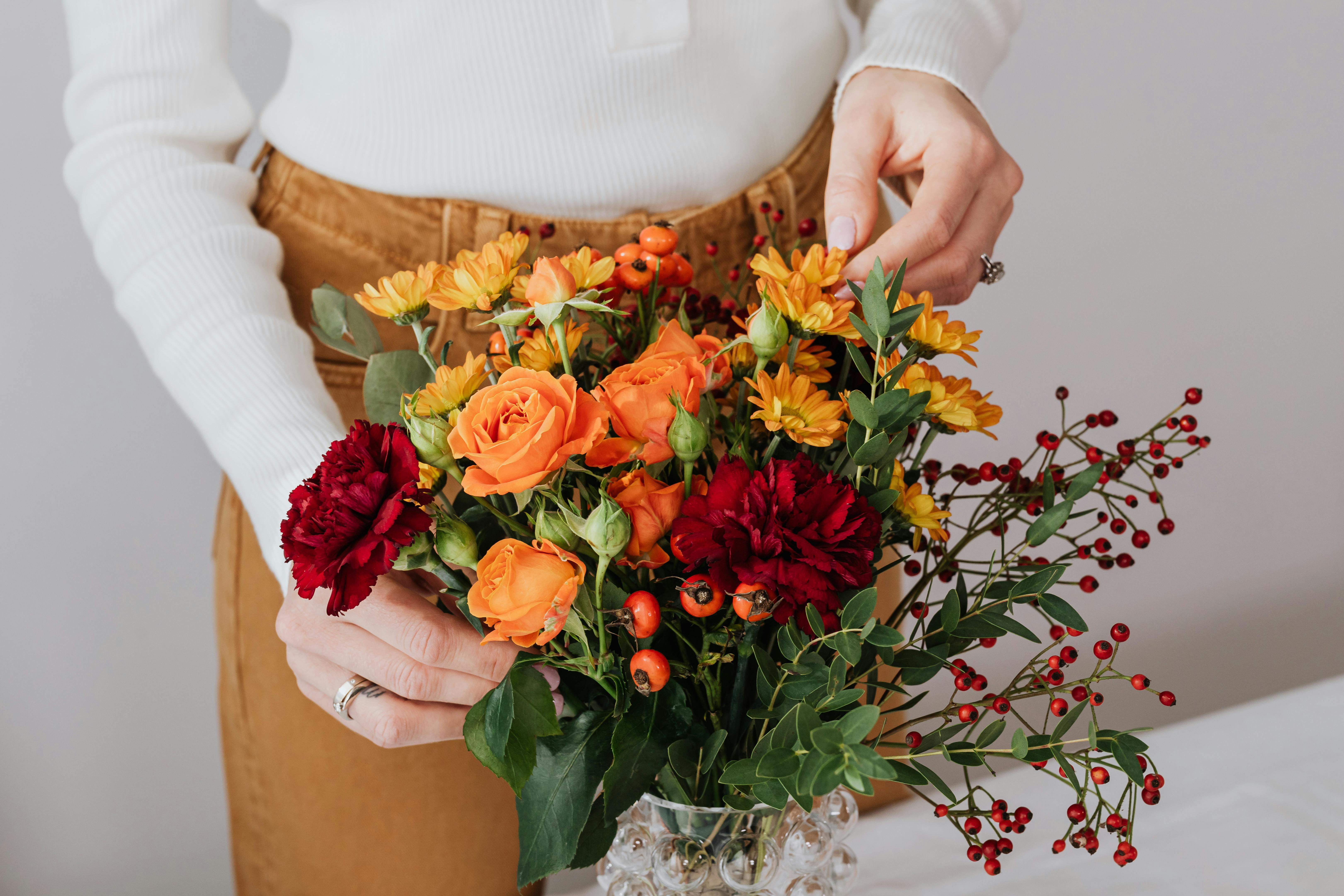 Round 2-layer Chocolate Cake Beside Two Assorted Flower Bouquet · Free ...