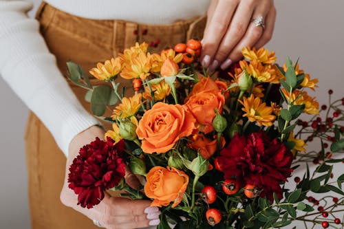 A Person Holding a Bouquet of Flowers