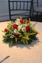 Red and White Roses Bouquet on White Table