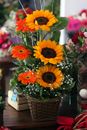 Yellow and Red Flowers in Clear Glass Vase