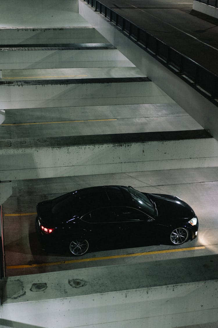 Black Car Parked In Empty Garage