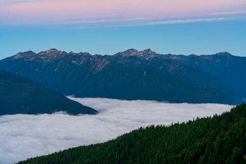 Beautiful Green Mountains Over the Clouds