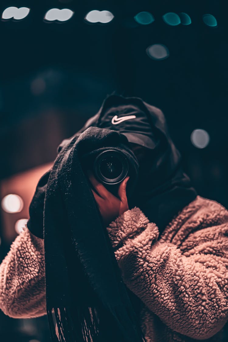 Faceless Photographer In Warm Clothes Taking Photo