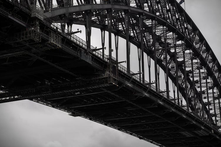 Modern Through Arch Bridge Under Cloudy Sky