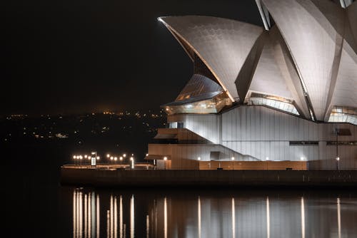 Exterior of futuristic Sydney Opera House at night