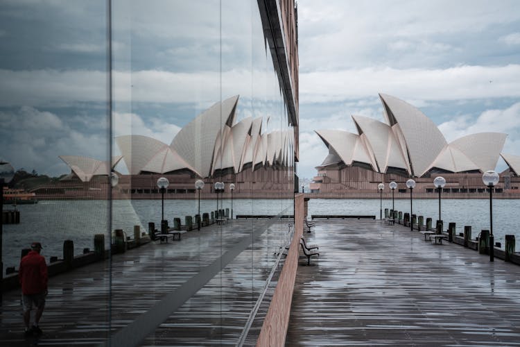 Majestic Sydney Opera House Reflecting In Neighbor Building Glass Wall