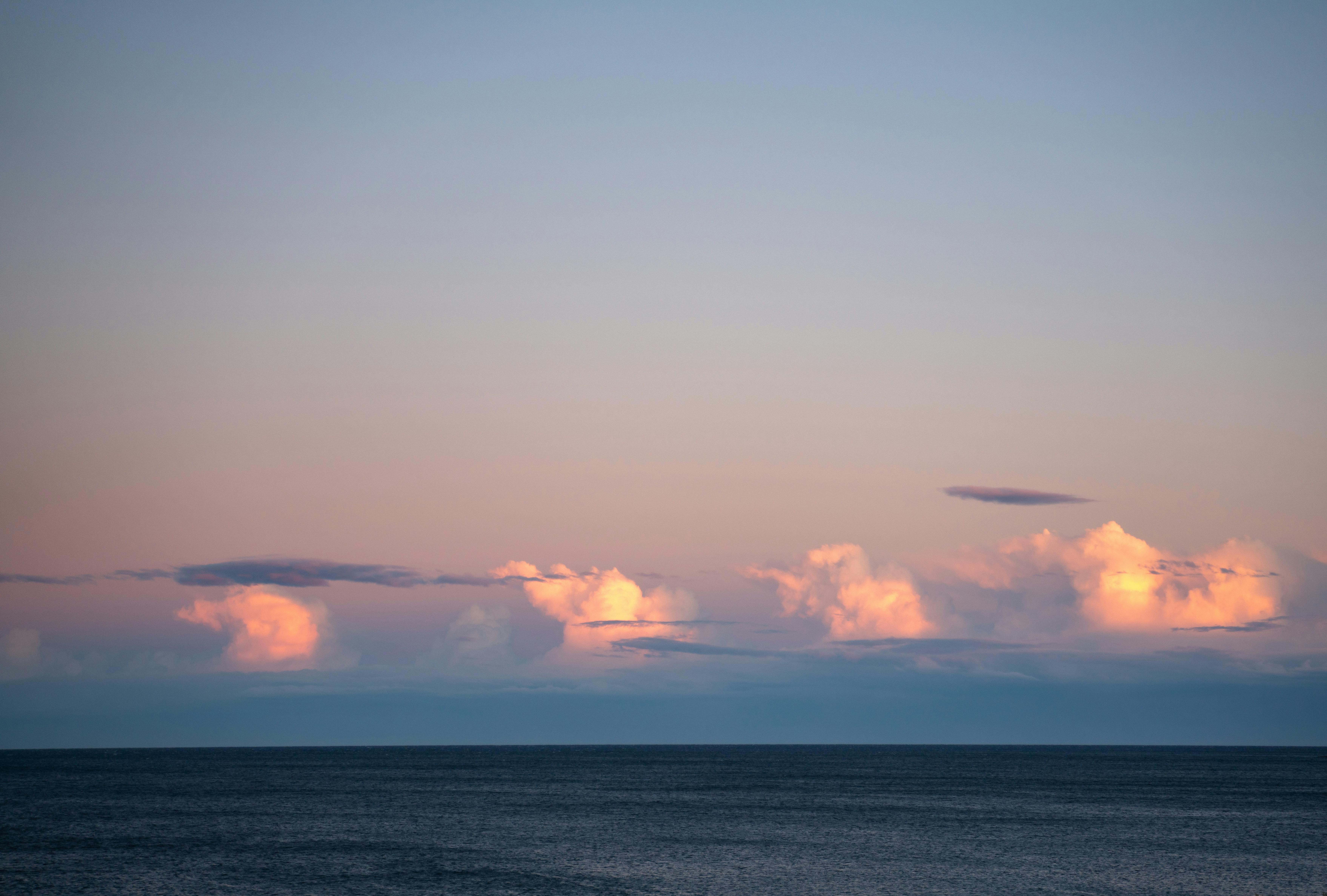 cloudy sky over rippling sea