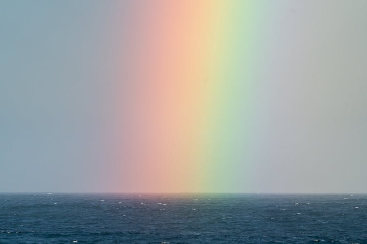 Rainbow On Sky Over Sea