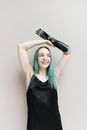 Woman in Black Tank Top Holding Hair Comb