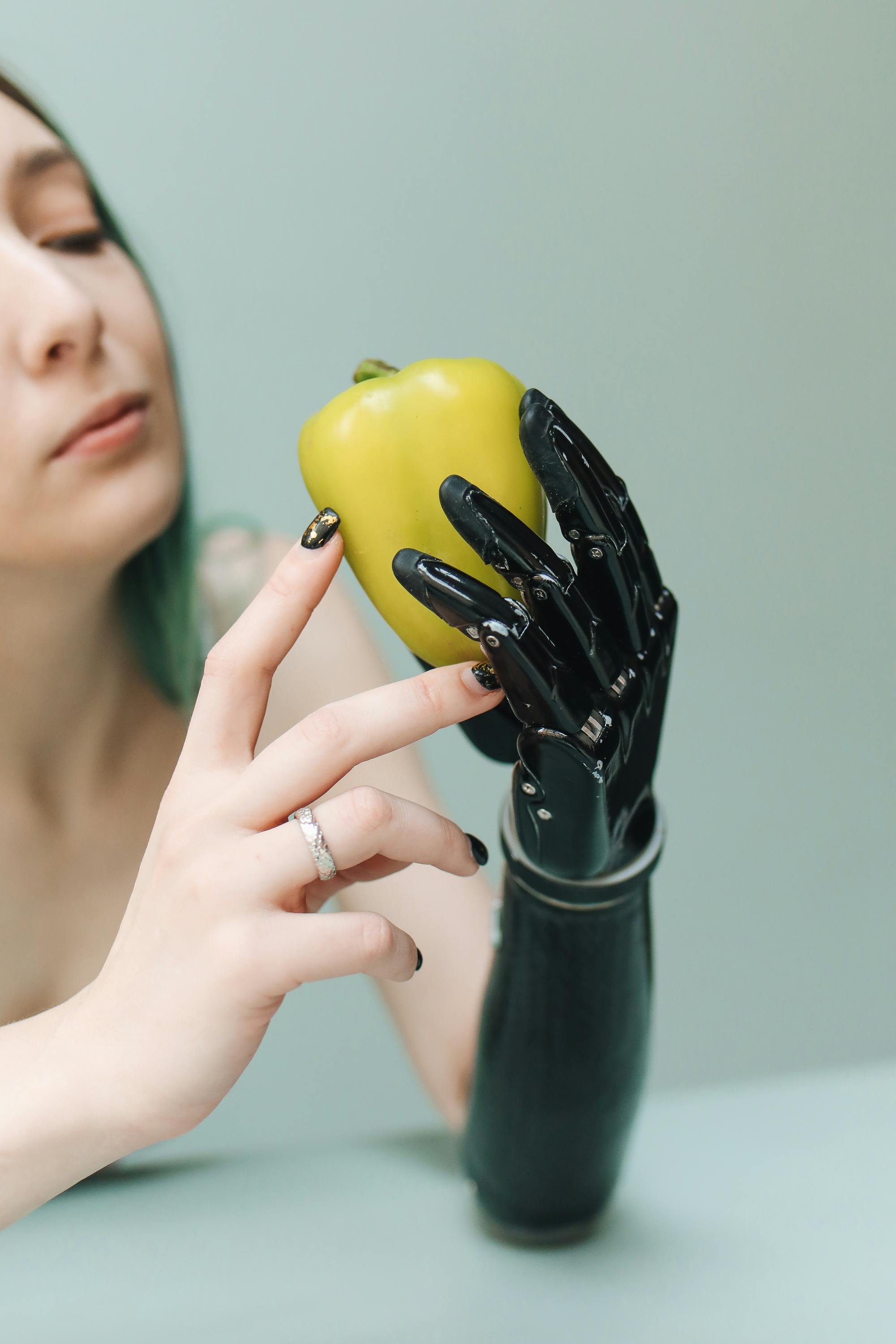 a woman holding a bell pepper