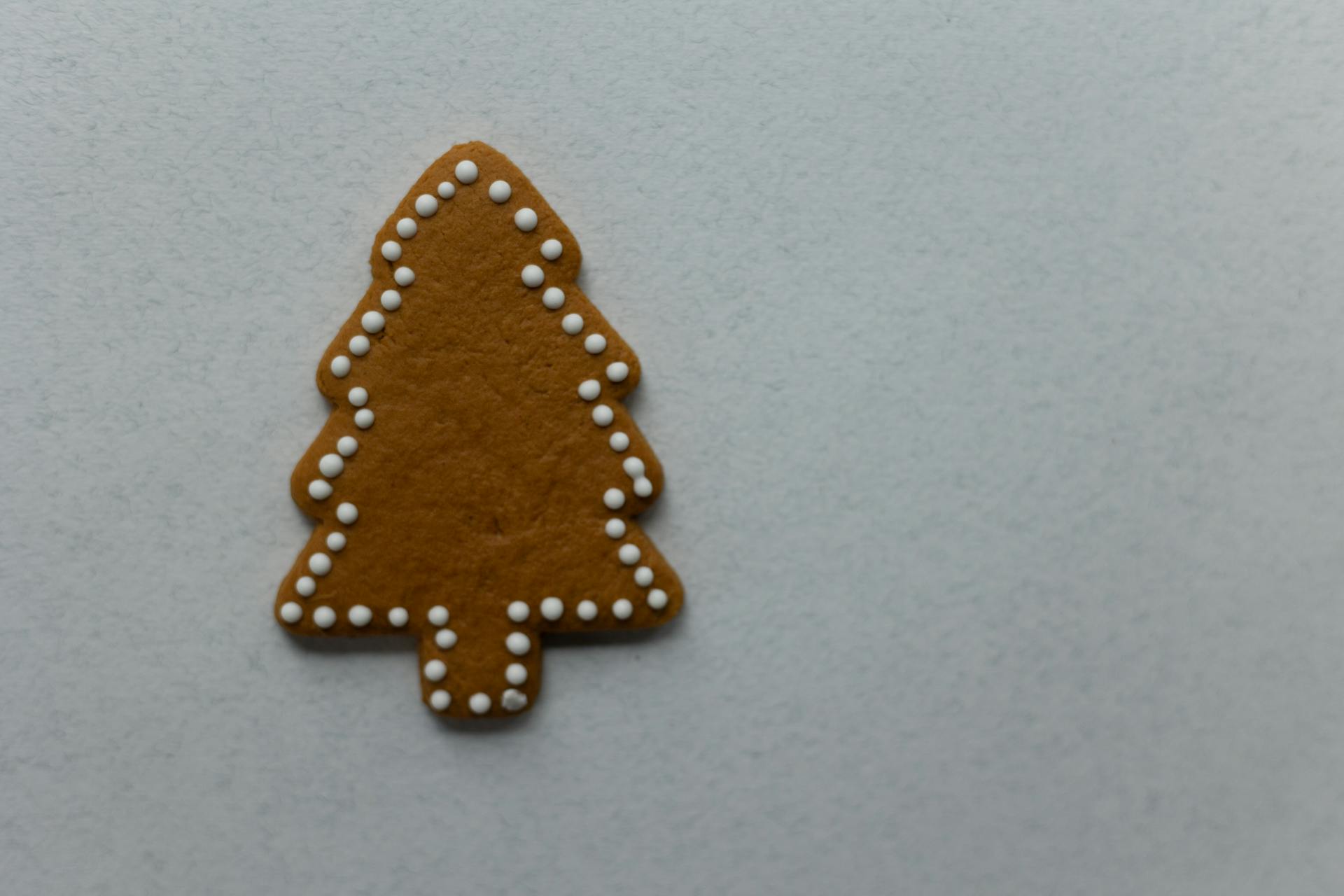 Tree shaped gingerbread placed on white background