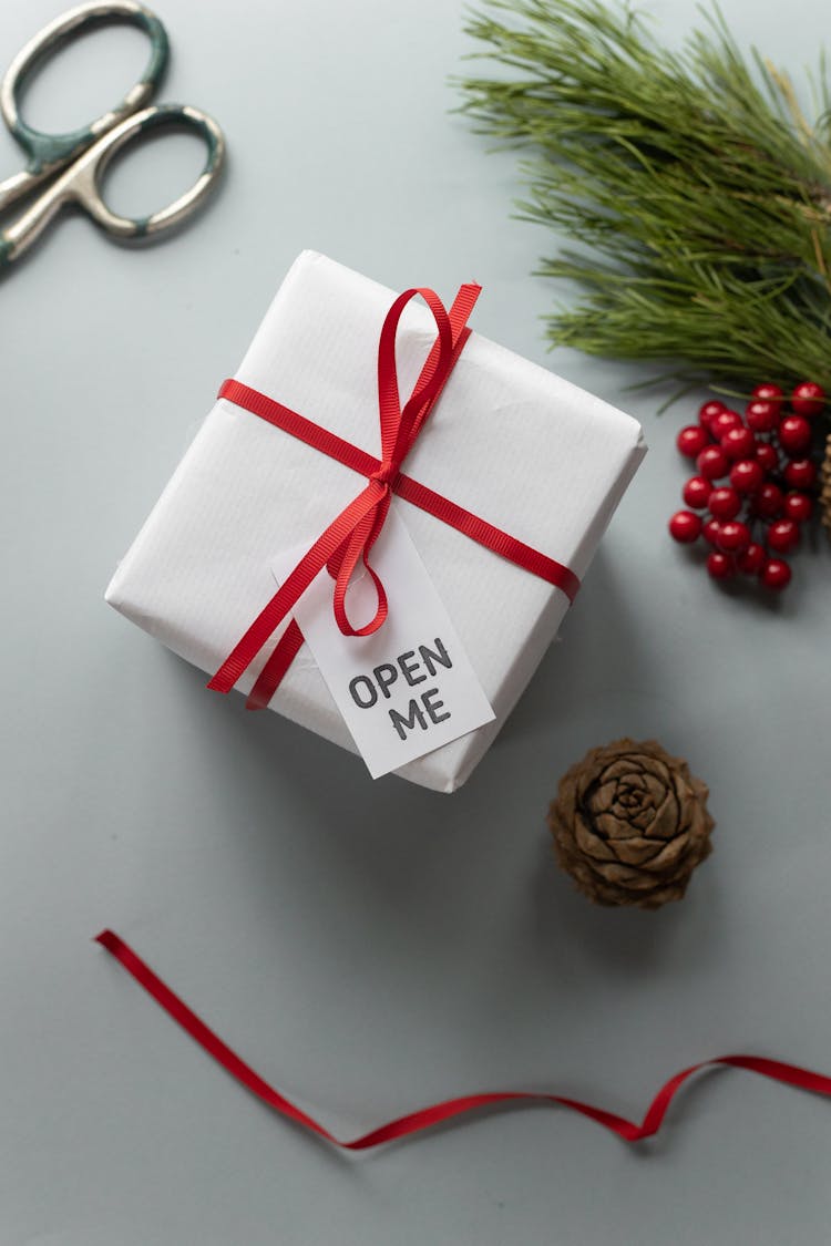 Open Me Inscription On Tag Of Present Box Near Decor