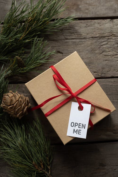 Gift cardboard box with Open Me title on tag