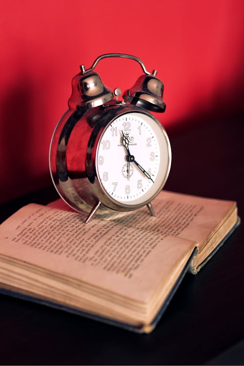 Clock on old book