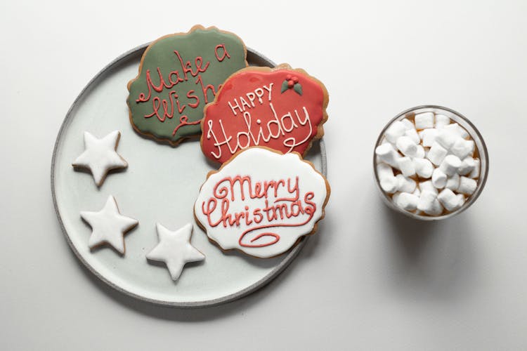 Marshmallows In Hot Chocolate Near Various Christmas Cookies