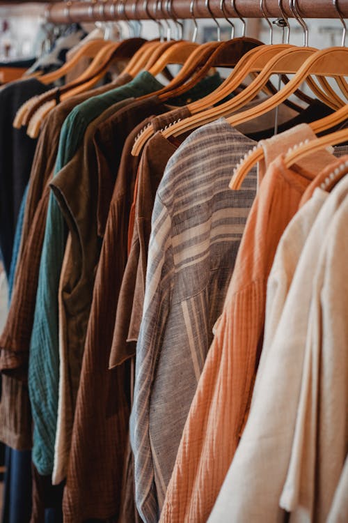 Free Assorted casual clothes on hangers in store Stock Photo