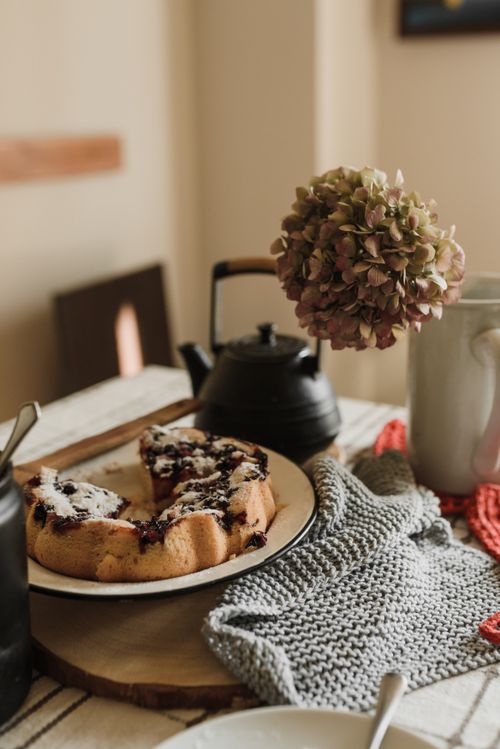 Free Warm, inviting scene of homemade blueberry cake and tea, perfect for an autumn afternoon. Stock Photo