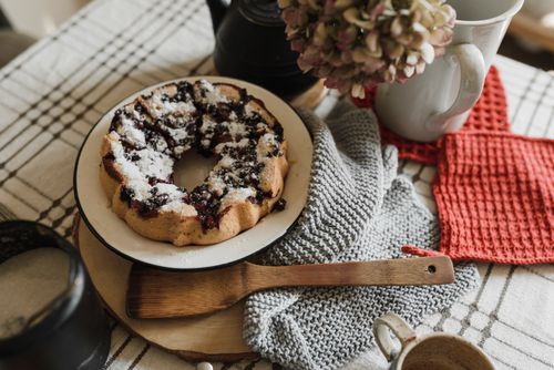 Free A delicious homemade berry cake served with coffee on a rustic table setup, ideal for cozy mornings. Stock Photo
