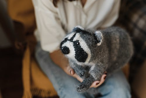 Free Close Up Photo of a Person Holding a Stuffed Toy Stock Photo