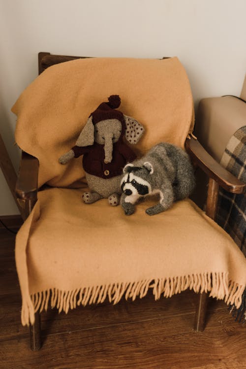 Free Plush Toys on a Wooden Armchair Stock Photo