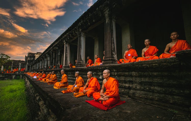 Monks In Lotus Position Meditating