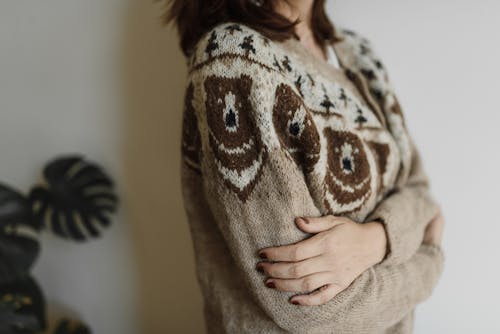 Woman Wearing a Knitted Sweater