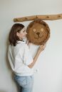 Woman in White Long Sleeve Shirt Holding Brown Round Bread