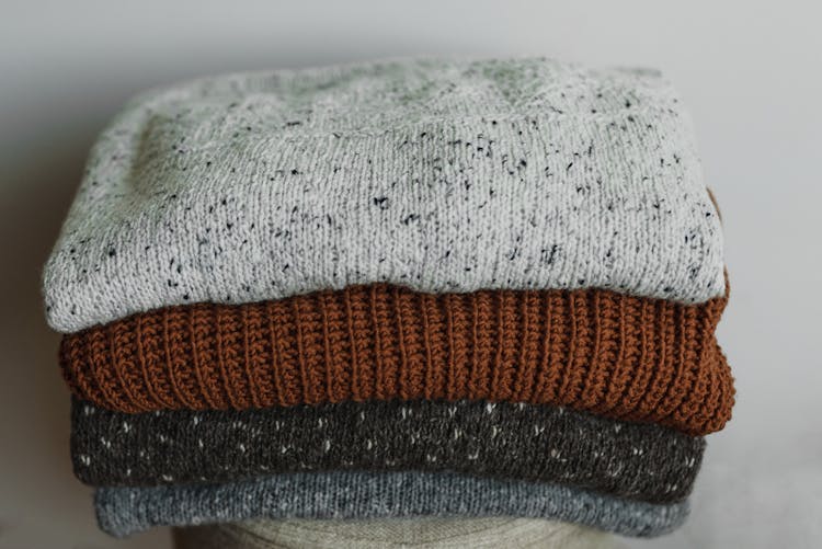 A Close-up Shot Of Stack Of Folded Knitted Fabrics
