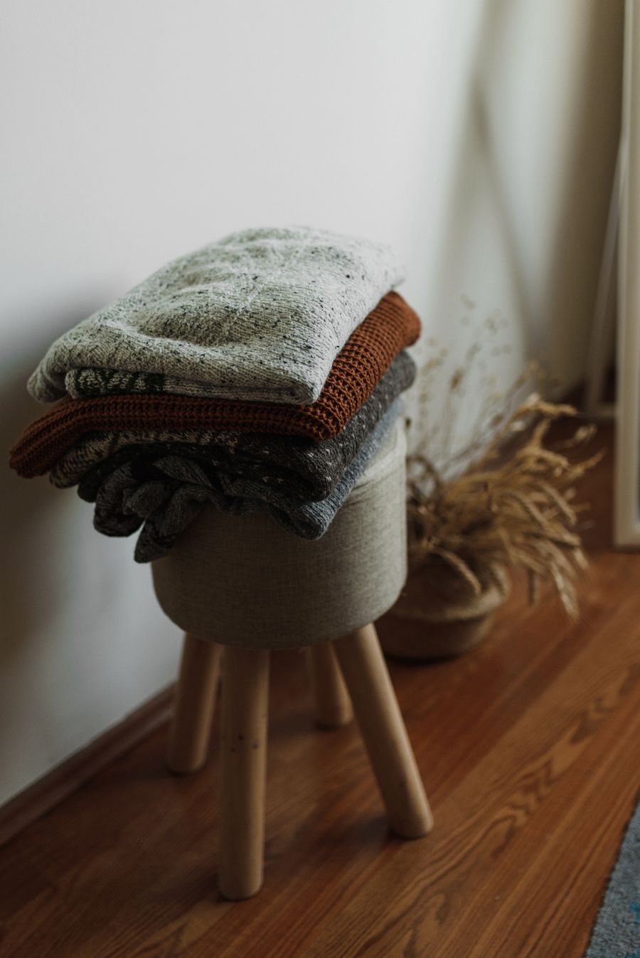 Professional Blanket Cleaning Qurtubah – stack of knitted blankets