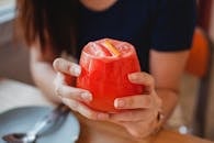 Crop woman with cocktail in hands