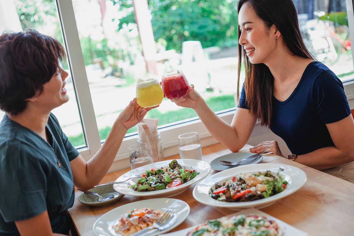 Plant-forward taco bowls with beans, rice, and colorful vegetables arranged on a table