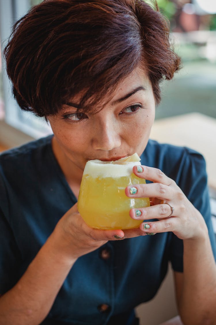 Asian Woman Drinking Fresh Beverage