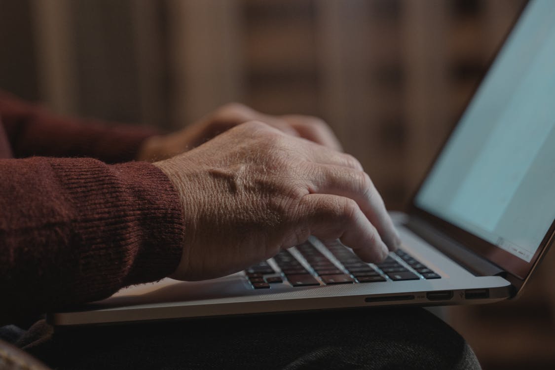 An image of a man using his laptop