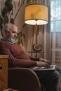 Man in Red Sweater Using Laptop Computer