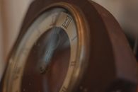 Brown and White Round Analog Clock