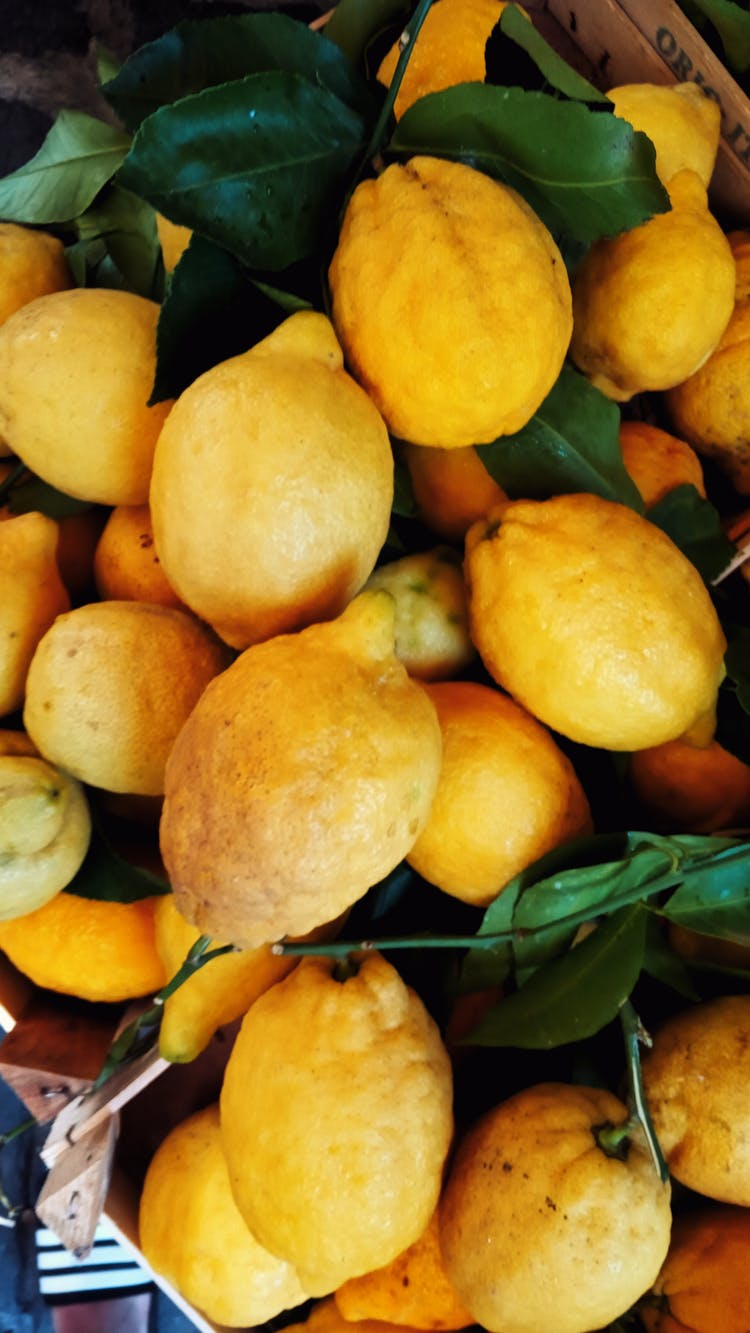 Ripe Lemons On Counter In Market