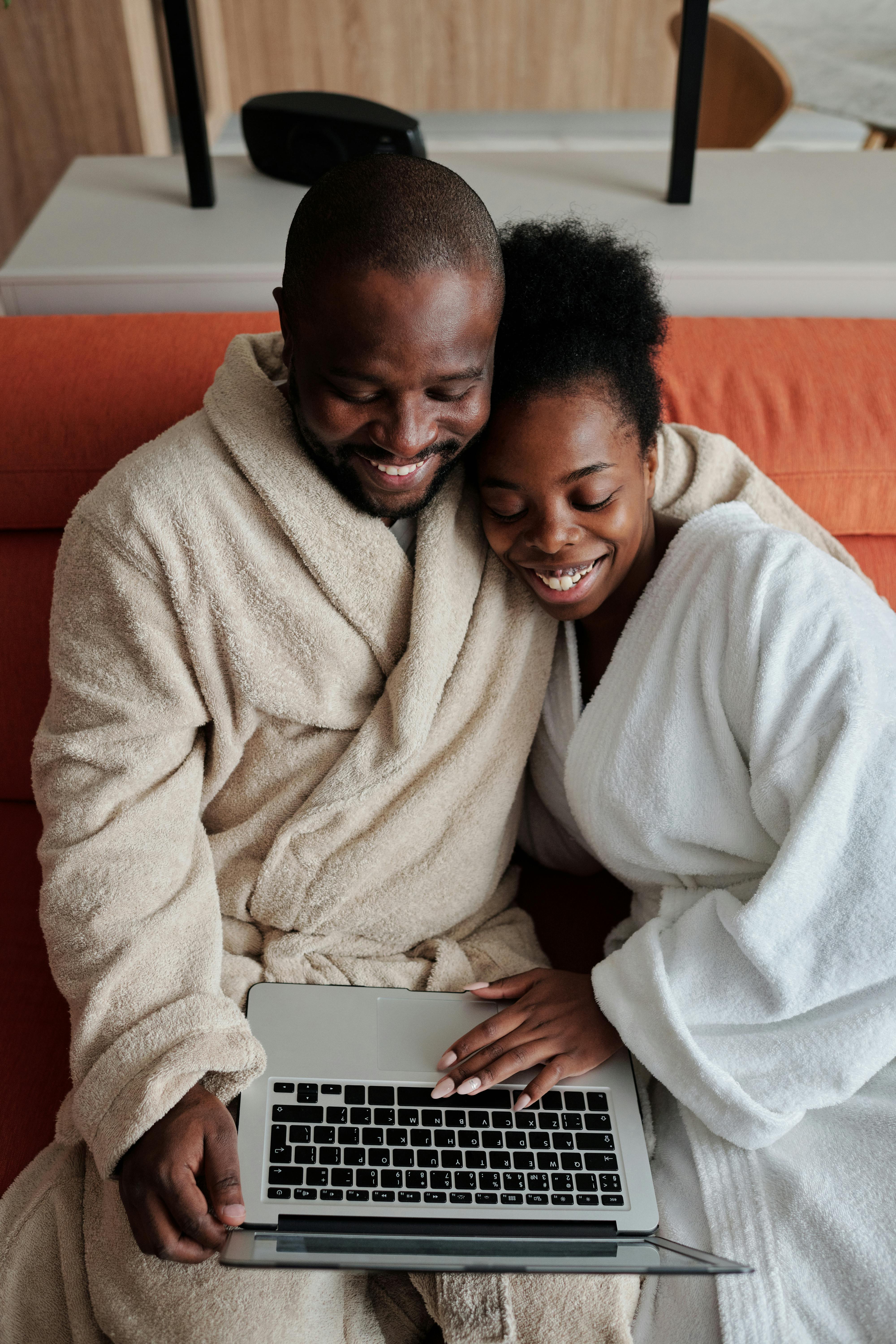 a couple watching in the laptop