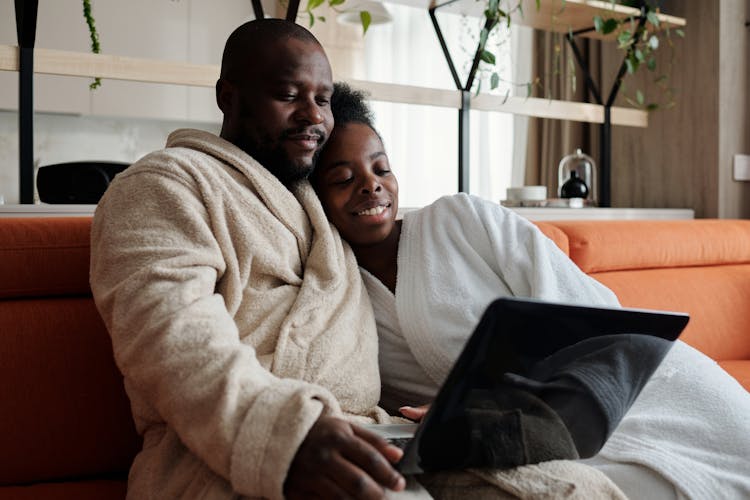 A Couple Watching On A Laptop