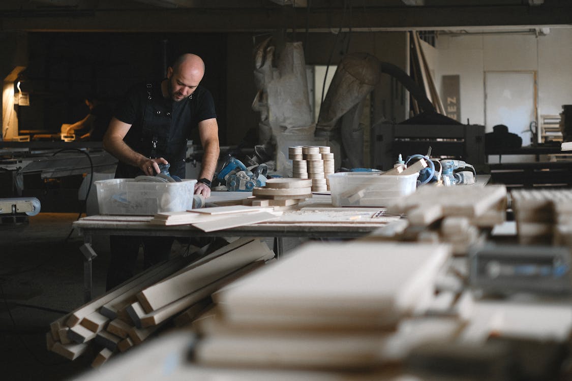 Focused craftsman working with wood