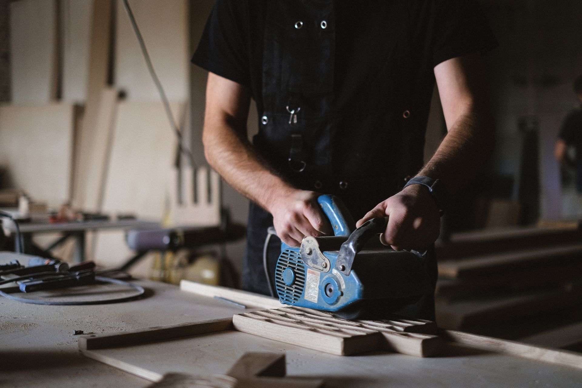Crop craftsman polishing wooden board