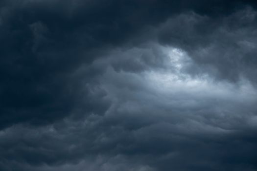 A moody, dark cloud formation creating a dramatic sky scene.