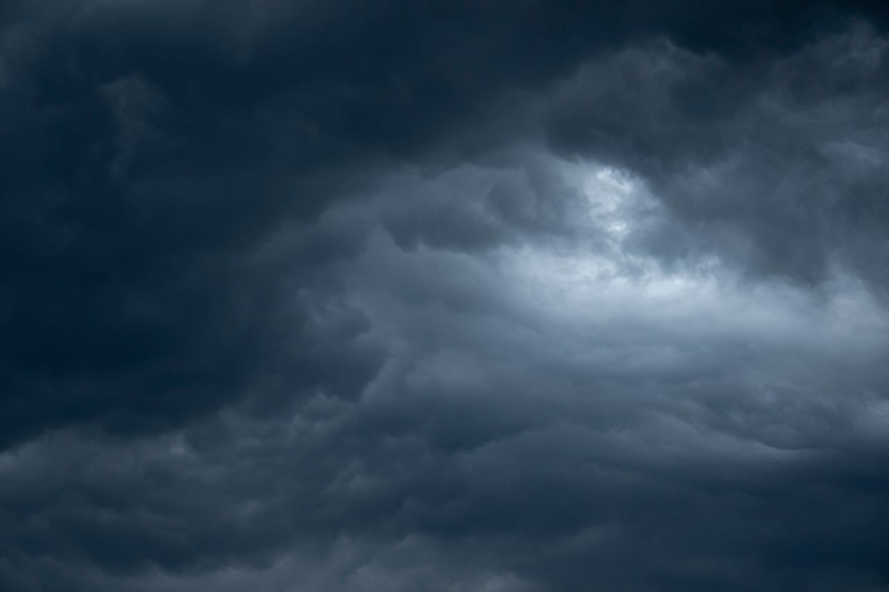 a moody dark cloud formation creating a dramatic sky scene