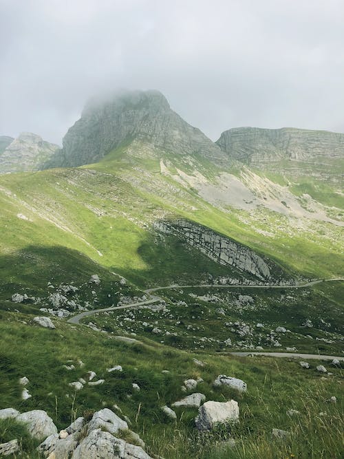 Green and Gray Mountains Under White Sky